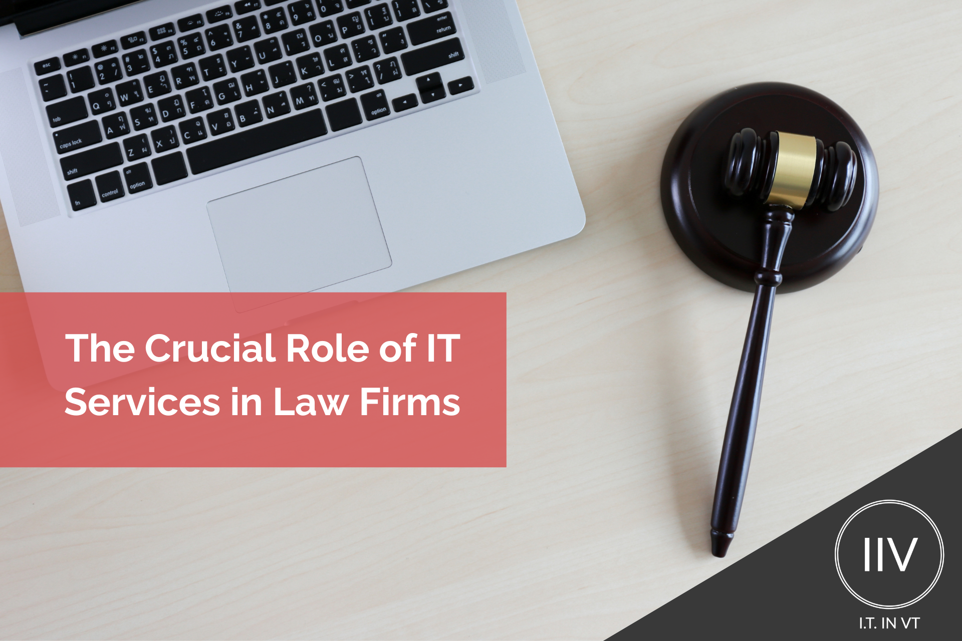A white table with black gavel and a laptop: Text the crucial role of It services in law firms